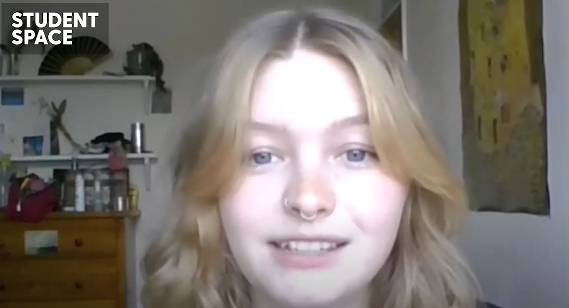 Screenshot of Sophie from the video, talking to camera in her bedroom.